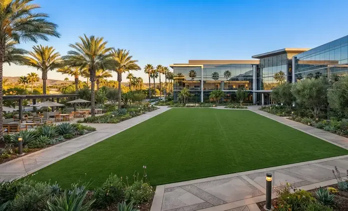 Completed commercial artificial turf installation enhancing the curb appeal of a modern business property in the Inland Empire