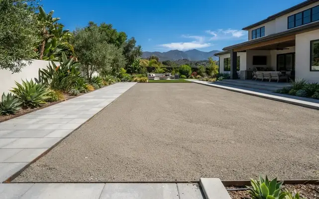 Professionally prepared artificial turf foundation with a smooth compacted aggregate base, precision grading, and clean hardscape transitions before synthetic grass installation in the Inland Empire