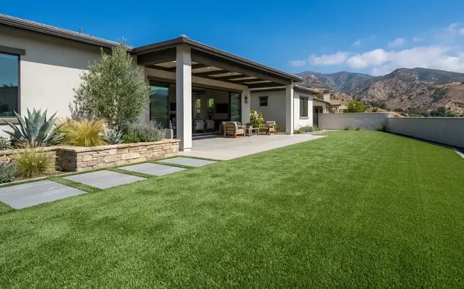 Completed residential artificial turf installation at luxury Inland Empire home